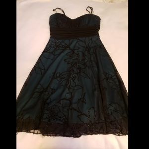 Green dress with black lace overlay